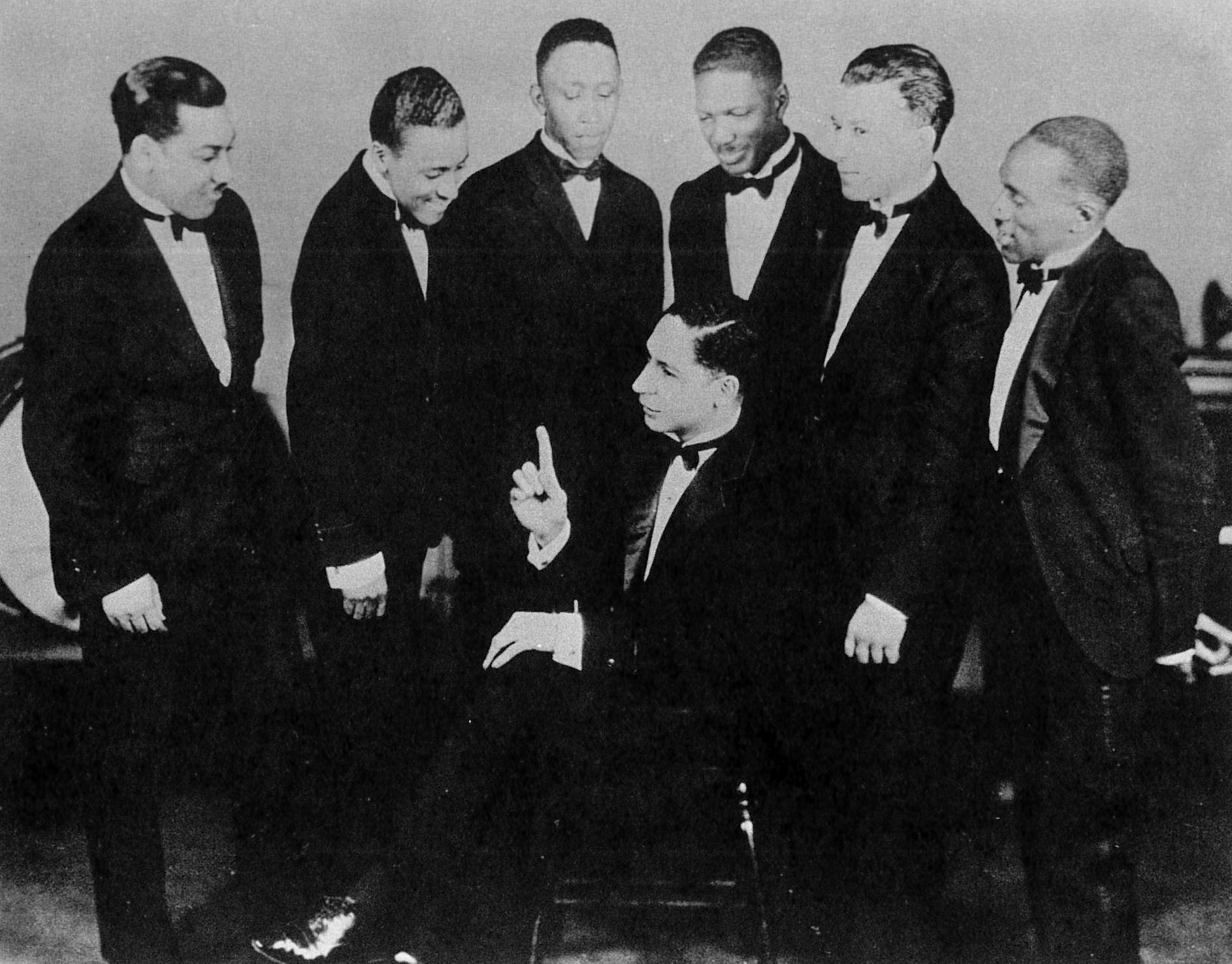 Morton seated with band around him