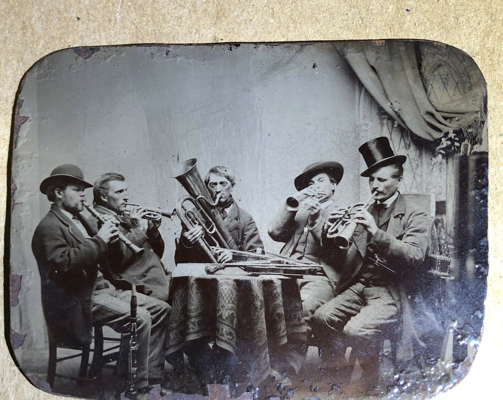 group of musicians around a table