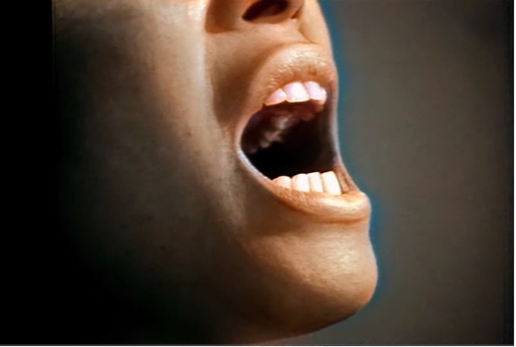 Extreme closeup with mouth wide open singing